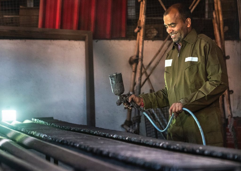 Blue Collar Worker with Paint Spray Gun